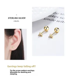 Macro view of 925 sterling silver gold screw back earrings with triangle zircon stud detail