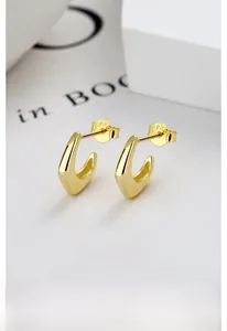 Detailed view of gold C-shaped S925 sterling silver earrings with multi-layer plating