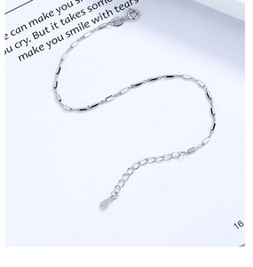 Detail of S925 sterling silver minimalist bracelet showing clasp and hallmark tag