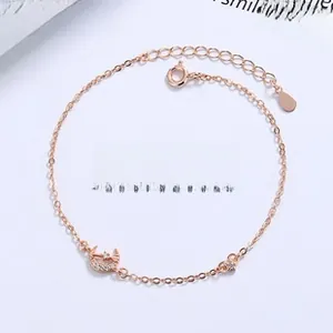 Detail of rose gold bracelet with Cupid arrow, heart and star zircon charms