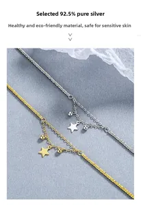 Detail of double-layer S925 sterling silver star bracelets in gold and silver finishes