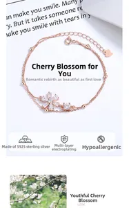 Detail of rose gold cherry blossom bracelet with S925 silver tag and white zircon stones