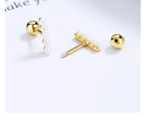 Macro view of S925 silver gold-plated pearl bar earrings with secure screw-back closure