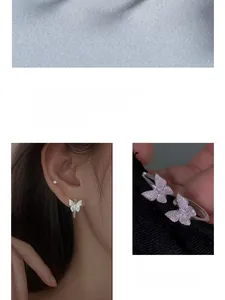 Detailed view of sterling silver butterfly stud earrings with pink and white cubic zirconia
