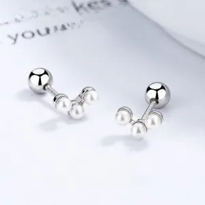 Macro view of S925 silver shell pearl earrings with screw back design and zircon