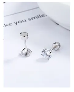 Detail of four-prong set cubic zirconia screw back stud earrings in 925 silver