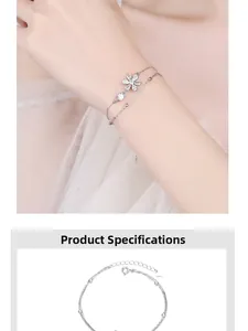 Detail of 925 sterling silver cherry blossom bracelet with zircon flowers on a double chain