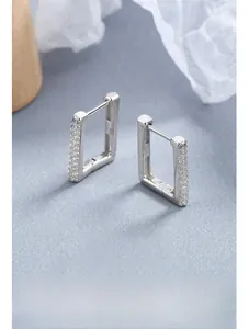 Macro detail of S925 sterling silver rectangular earrings with micro-set zircon stones