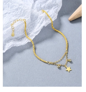 Detail shot of a double-layered S925 sterling silver star bracelet with a gold finish