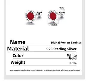 Macro shot of 925 silver stud earring with Roman numerals and red enamel center disk