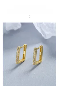 Detailed macro view of S925 sterling silver square hoop earrings with inlaid zircons