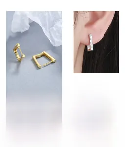 Detail of square S925 sterling silver hoop earrings with zircon accents and model view