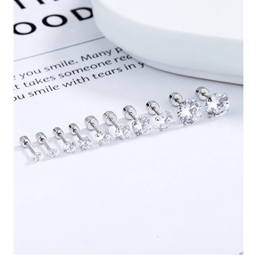 Macro shot of tiered cubic zirconia screw back earrings in various sizes from 2mm to 8mm