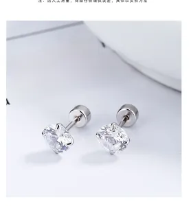 Macro shot of clear zircon stud earrings with 925 sterling silver four-prong setting