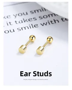 Macro shot of S925 sterling silver stamp on minimalist gold cylindrical screw earrings