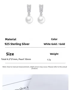Détail macro de boucles d'oreilles en argent 925 en forme de V avec une perle de 10mm
