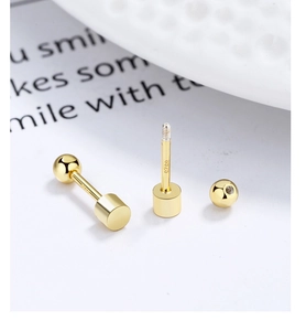 Detailed close-up of S925 sterling silver cylindrical screw back stud earrings in gold