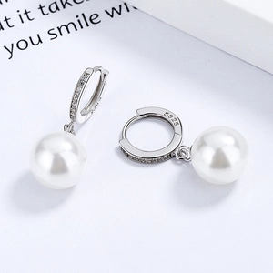 Elegant 925 sterling silver hoop earrings featuring white pearls and micro-pave cubic zirconia