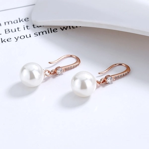Élégantes boucles d'oreilles en argent 925 avec perles et crochets en or rose sertis