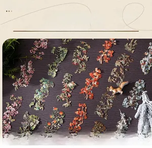 Macro shot of seasonal branch stickers with cherry blossoms and maple leaves on wood