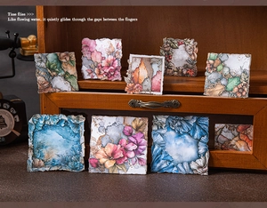 Macro view of vintage plant border stickers with rustic torn edges on a wooden surface