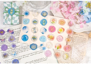 Close-up of assorted vintage wax seal stickers with floral designs for scrapbooking