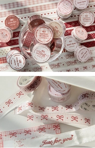 Macro shot of vintage crimson masking tape with plaid patterns for DIY scrapbooking