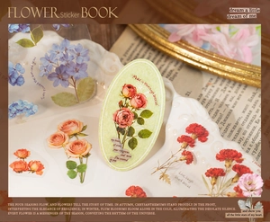 Close-up of vintage flower stickers with roses on a white plate for DIY scrapbooking