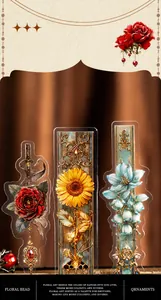 Macro detail of vintage floral and jewelry theme stickers on a bronze satin background