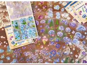 Macro view of vintage style translucent floral PET stickers for DIY scrapbooking