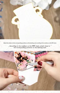 Detail of applying floral PET stickers on a numbered DIY puzzle card with tweezers