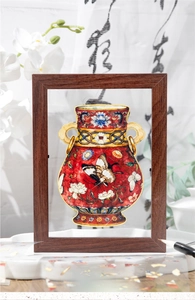 Detailed close-up of a DIY wooden frame featuring a traditional Chinese red porcelain vase sticker