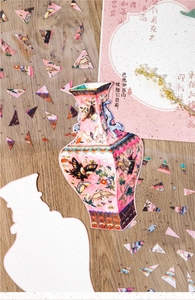 Macro view of Chinese style porcelain PET sticker puzzle with floral patterns on wood surface