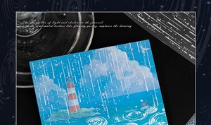 Macro shot of blue seaside lighthouse stickers for DIY scrapbooking and artistic journals