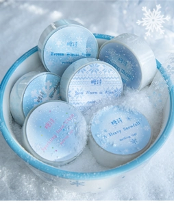 Close-up of Frozen Winter Snow theme PET tapes with snowflakes in a decorative snow bowl