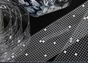 Macro shot of semi-transparent PET decorative tapes with starry sky and mesh patterns