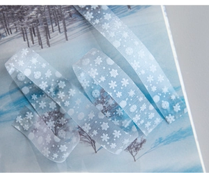 Detail of light blue snowflake PET tape for winter scrapbooking and journaling diy