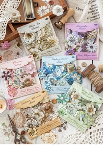 Flat lay of vintage floral cardstock stickers for journaling showing six colorful packs