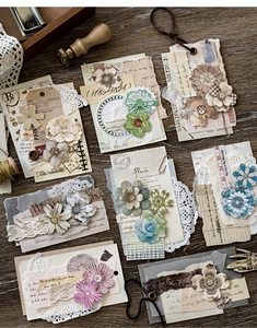 Detail of vintage collage scrapbooking kit with lace, fabric flowers and buttons