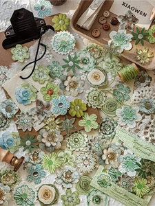 Detailed view of green vintage handmade floral stickers with buttons for DIY scrapbooking