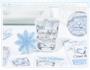 Macro detail of ice cube themed stationery stickers with creative blue winter patterns