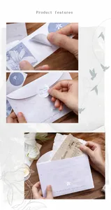 Detail of silver-stamped envelopes with lily stickers on a vintage wooden desk background