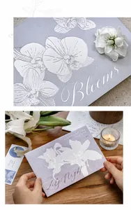 Detail of silver stamped orchid and lily patterns on premium matte paper cards