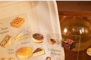 Détail d'autocollants de desserts dessinés à la main avec motifs gaufres et gâteaux en PET