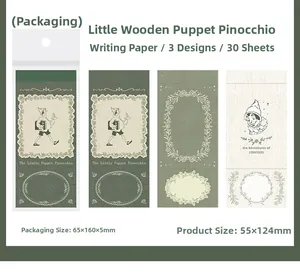 Detail showing vintage Pinocchio themed writing paper and bookmarks for scrapbooking