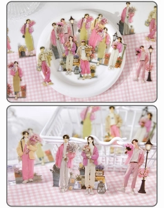 Detail of floral fashion character stickers displayed on a white porcelain plate