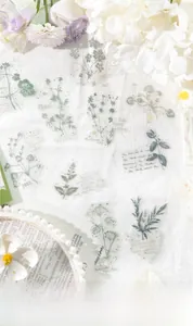 Detail of vintage plant stickers and handwritten typography for scrapbooking DIY projects