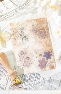 Close-up of vintage flower PET stickers for journaling with retro 1902 date stamps