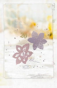 Detail of vintage PET sticker with purple floral design and 'Blossom' text for scrapbooking