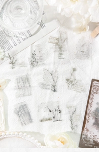 Detail shot of vintage PET floral stickers with botanical designs and music score elements
